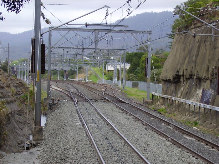 The view through the road bridge arch at the down end of Austinmer station showing the northern entrance to the Thirroul yards.