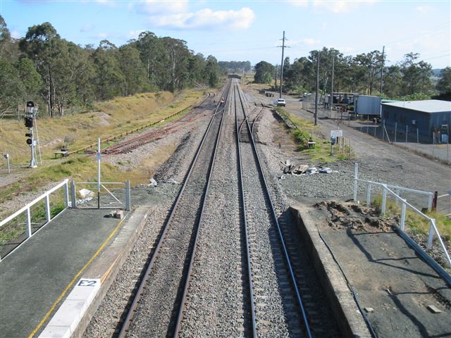 
The view from Branxton looking north.  The branch in the left distance is the
one-time branch to the Ayrfield Colliery.  The former goods siding branches
off on the right.
