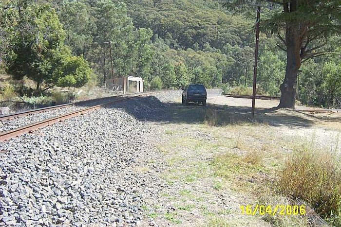 The Up water tank and column is behind the photographer, with the other water tank and column further up around the bend. This photo is looking towards Clandulla. The car is stopped on the location of the former crossing loop track, and near the location of the waiting shed.