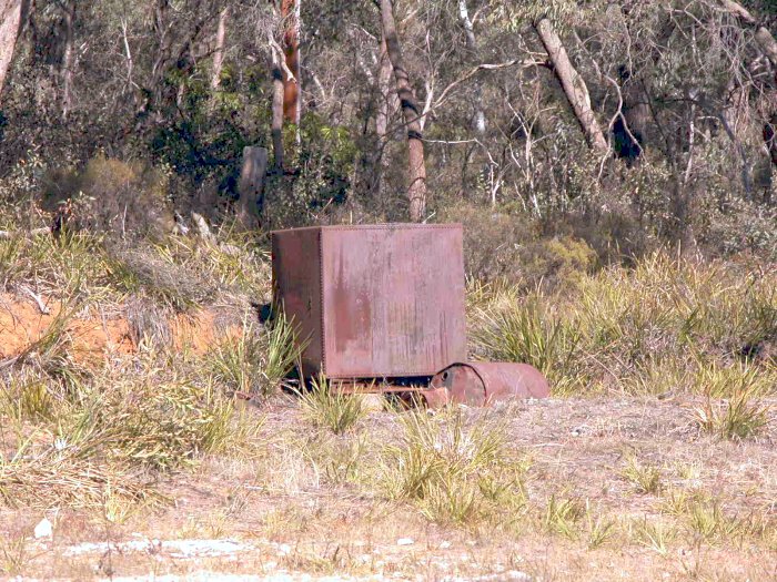 A rusting metal tank sits above the station location.