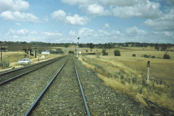 
The view looking down the line to the location of Fish River.
Note the water tank on the left and the old water column on the right.
The signal box can be seen in the distance at the curve; this is
the only remnant of the station.

