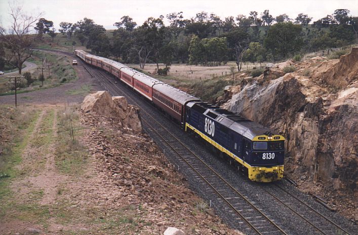 
8130 hauls an ARHS charter train through the junction at Gap, heading
down the cross-country line to Binnaway and Dubbo.  The line on the
left heads north to Narrabri.
