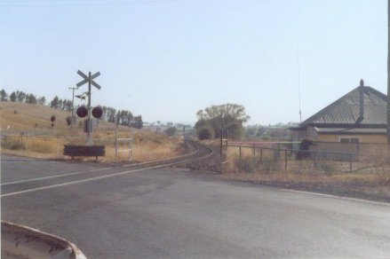 The level crossing at the up end of the location.