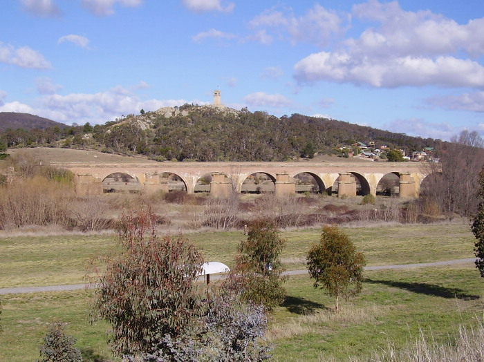The main south crosses the Mulwarree Ponds just east of Goulburn on a substantial brick viaduct.  The current crossing is the second and in this view of the northern side, the remains of the piers of the first crossing can be seen next to the viaduct.  This picture is taken from the Crookwell branch line looking south-east.