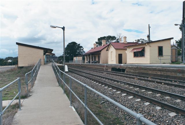 
The view from the southern end of the platform.  The building on the
right was the signal box; the hole where the rodding went is still
visible in the platform face.
