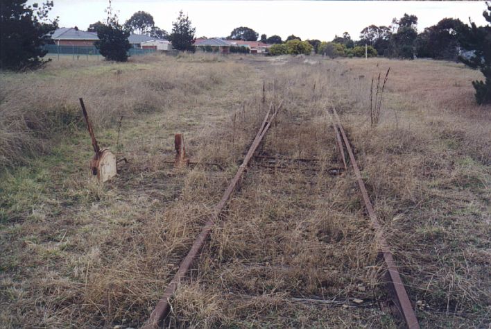 
The A lever frame and lock at the up end of the siding.  The tall white
post in the middle right marks the one-time location the platform.
