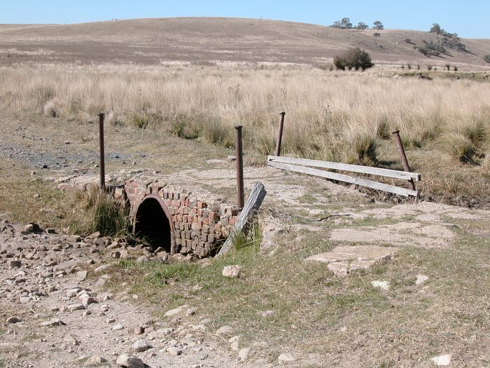The brick culvert next to the main road.