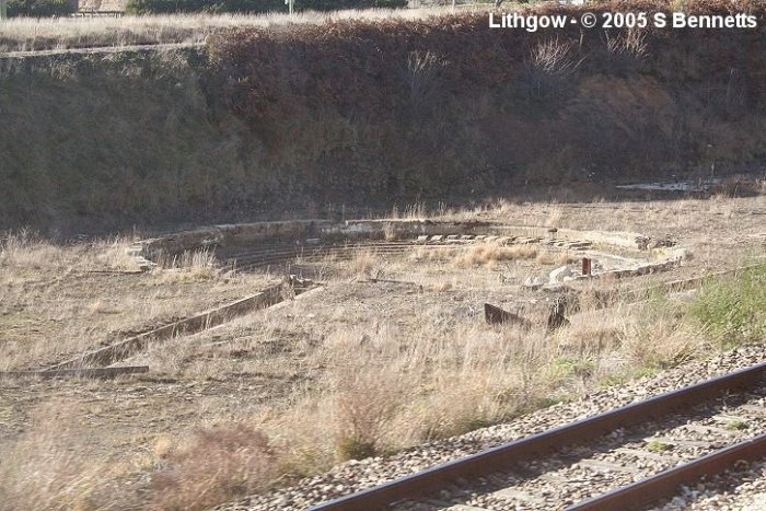 A photo of presumed turntable and ash pits located next to Up main between Eskbank and Coal Stage Box. This photo taken from Up train and at the top of this photo runs the line into the Lithgow State Mine. The Blast Furnace park is behind this view. Track in the foreground is an Up refuge that runs down through the shed next to Eskbank station.