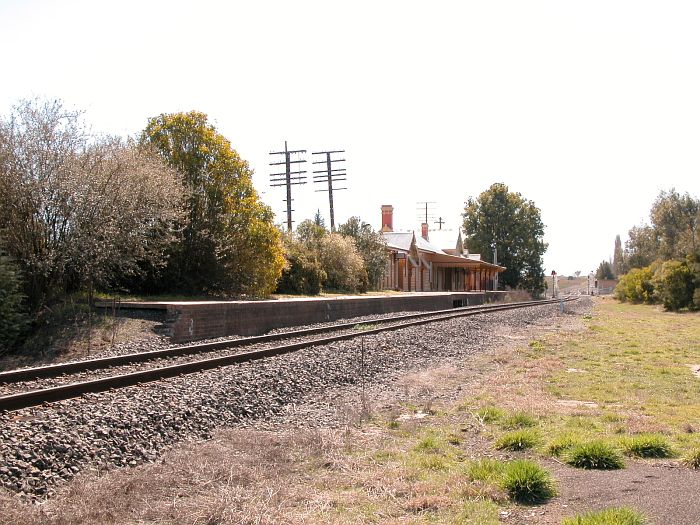 
The view of the station looking down the line.  The junction for the line
to Dubbo is in the distance, just beyond the level crossing.
