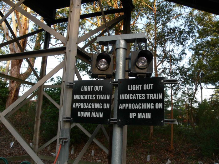 The warning lights on the down platform for track workers.
