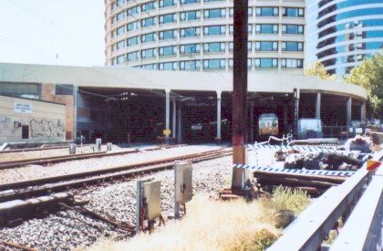 The view looking north towards the undercover North Sydney station. A city-bound service is just leaving platform 1.