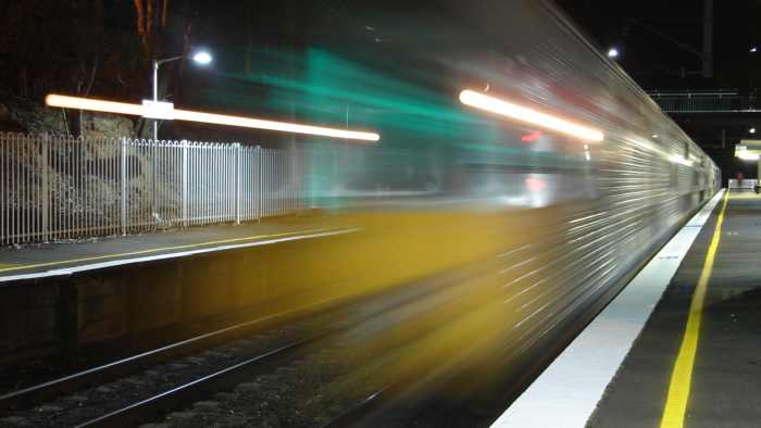 A city-bound S set passes through the Up platform.