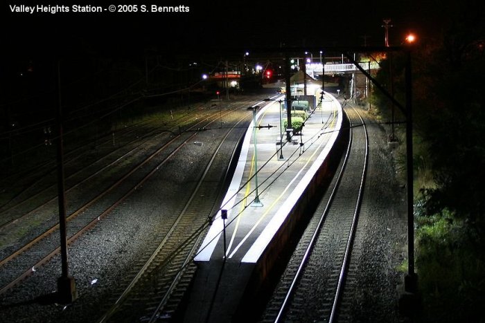 A photo taken after dark from the road bridge at the Sydney end of Valley Heights looking west. Photo shows the shapely island platform with the Up main on the right, the Down main and Down refuge loop and sidings on the left.