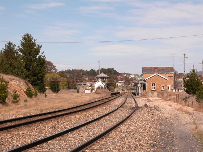 The view approaching the station from Sydney.  The former yard was on the left hand side.  The dirt track markes the location of the former double track dock.