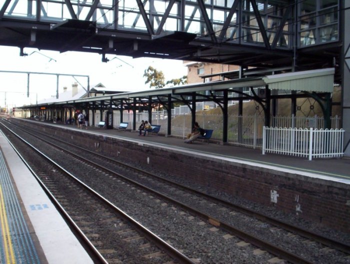The covered waiting area on the Up platform at Wollongong. Viewed looking back towards Bomaderry.