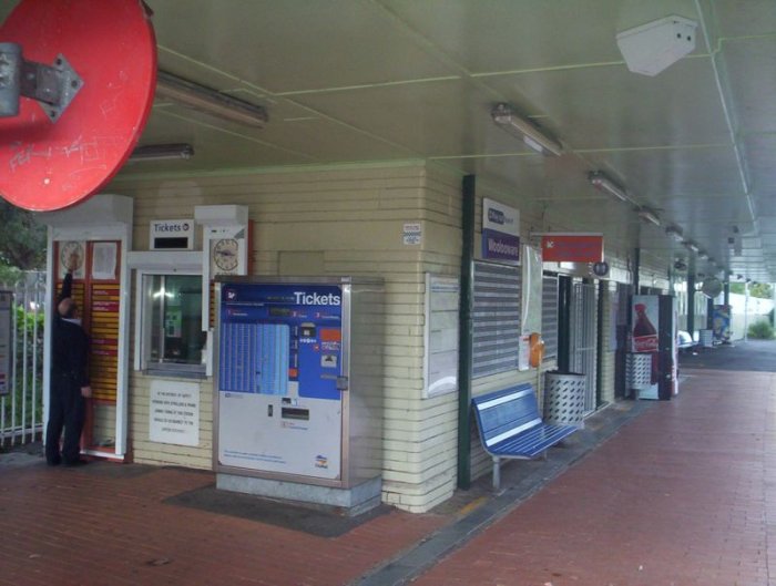 The ticket office, indicator boards and ticket machine at Woolooware. The red disk in the top left is a mirror for the guards.