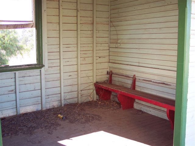 
A wooden bench remains in the waiting room.
