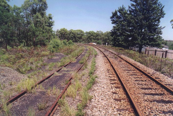 
The remains of the down main sit alongside the up main.  The
now-demolished platforms were located near the curve in the distance.

