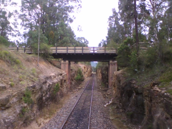 The view as the line passes under the former Kalingo Branch bridge, looking towards the site of Bellbird Colliery in the distance.