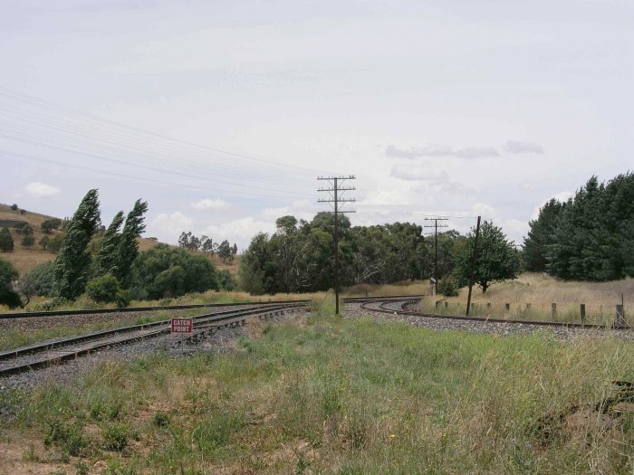 The junction of the line to Cowra. The Main West is on the left, with the branch line on the right. The line in the centre is the Purina siding.