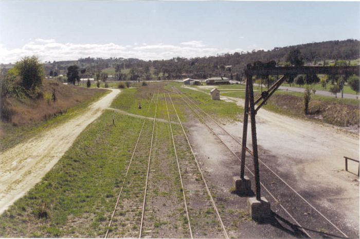 The view from the footbridge looking towards Sydney.  The tracks are the main, loop and goods lines.  In the distance, the stock siding can be seen branching off the to left of the main line.  The small building is a weighbridge.  The one-time loco facilities of an engine shed, coal stage and turntable were located in the middle distance. 