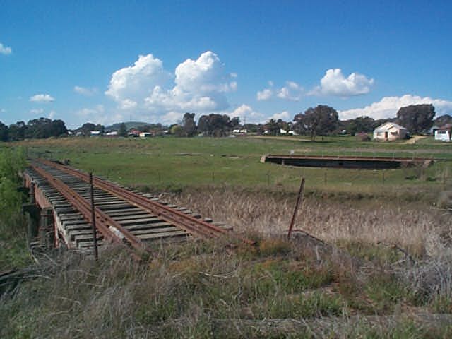 
The view from the entrance to Boorowa yard.  Beyond the turntable was
an engine shed, and to the left of it was a coal stage.  The station and
the rest of the the yard was located just out of picture in the left
distance.

