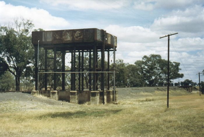 
The massive structure of Bullenbung Creek Tank stands in testament to
the days of steam travel.  In the background is the culvert over the creek
which gave the tank its name.

