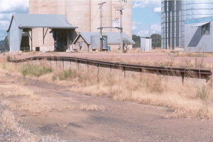 The loading bank at Burrumbuttock is still intact although the remains of the goods platform that in 2004 could be still seen to the left of the bank has now been removed to widen the access road to the silos.