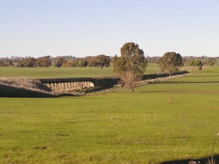 Wide view of the timber trestle and the line heading east from Burrumbuttock.