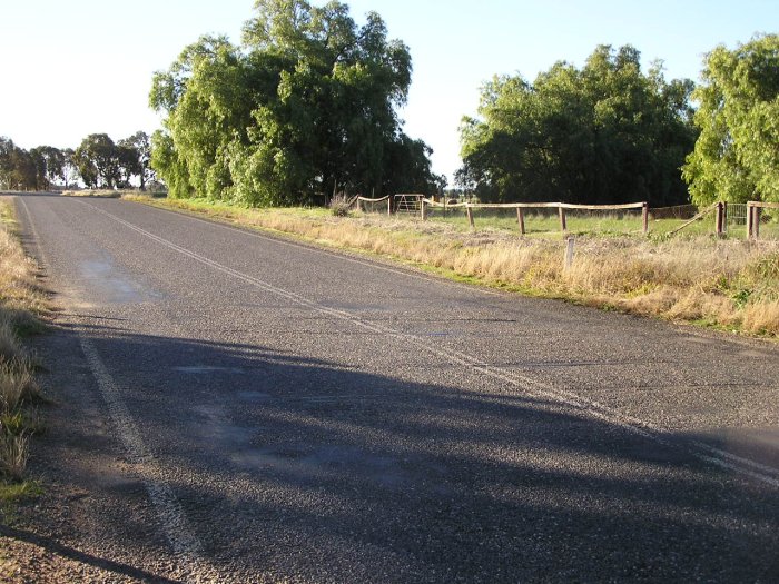 Northbound view of rails still in the Urana Road level crossing.