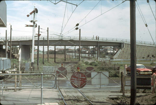 This view shows the up end of Camellia. The starter signal has been pulled for the road and the fish tail signal under it is the fixed distant to Rosehill Racecourse Box.