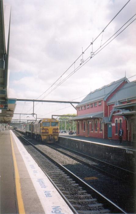 
Campbelltown station before the additional covered waiting areas went in.
FL200/EL62 are working an empty container train north.
