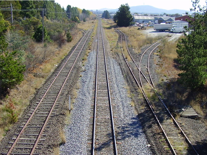 The view of the Canberra branch line from the Newcastle Street bridge looking towards Canberra station and showing the disused sidings along the line at Fyshwick.