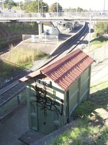 This hut (at the Sydney end) tells us Cardiff Station is 96 miles from the state's capital. This structure features concrete walls and a pressed-metal fake "terracotta" roof!