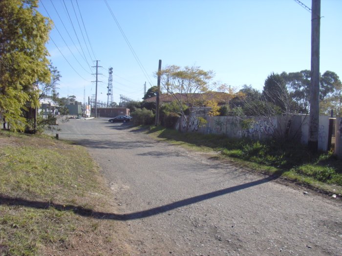 Following the the curve of the roadway and fence line, the alignment of the former Electricity Commission siding at Carlingford continued along towards the now Integral Energy Sub-Station.