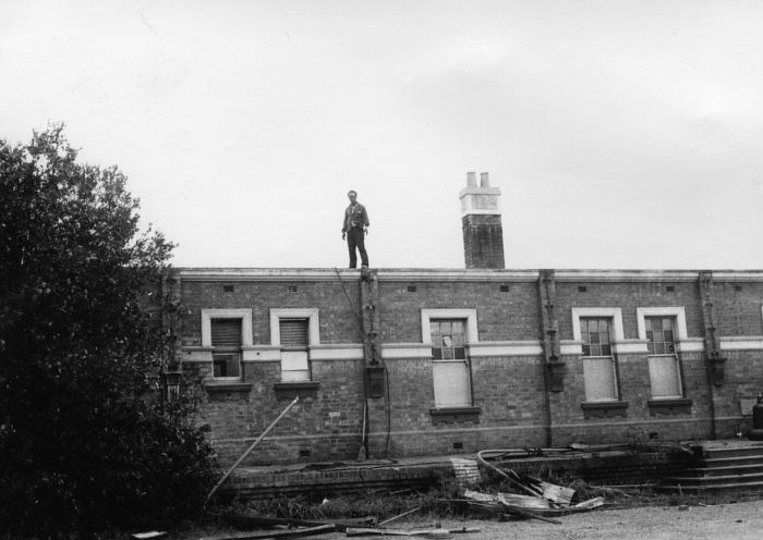 
The rear of the station building, complete with demolition worker.
