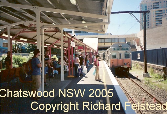 The view looking north along platform 2 as a city-bound service approaches. This is before the station rebuilding commenced, although the former platform 1 on the right has been fenced off.