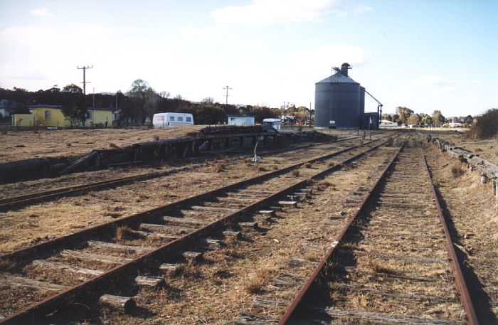 
The view looking towards the end of the line.  On the down side of the yard
are the goods platform and silos, with the passenger platform opposite.
