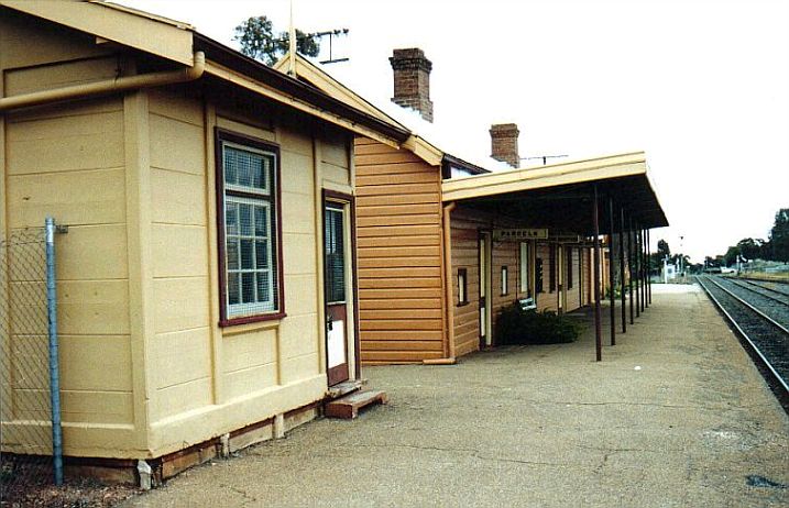 
The view looking along the platform in the direction of Narrandera, showing
the signal box and well-presented station building.
