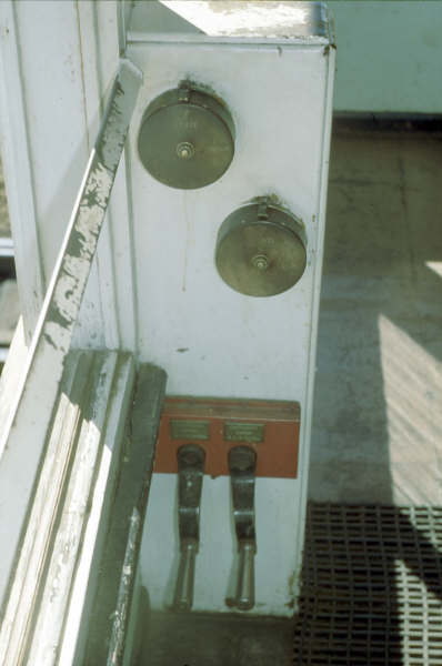 The gate controls for the level crossing. The manual cranks can be seen below.