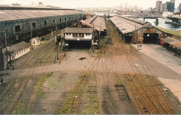 
The view looking north showing (L to R) the Double Tier Goods Shed, the
Outward Goods Shed and Outwards Goods Shed (West).  In the right distance,
the Pyrmont Bridge is in the open position.
