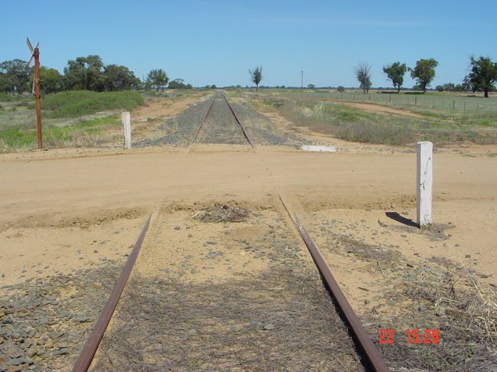 
The crossing indicates that trains have not recently travelled here.  The
station location is believed to be on the left.
