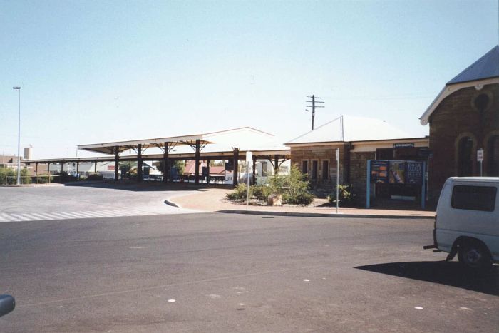
The former Narromine end bay platform where the mail used to be loaded
onto/from the Sydney Mail; has been replaced by an elevated ramp for the
rail replacement coaches to park in the shade.  The shorter canopy in front
of the longer rear canopy on the platform was built for the coaches in the
early 1980's.
