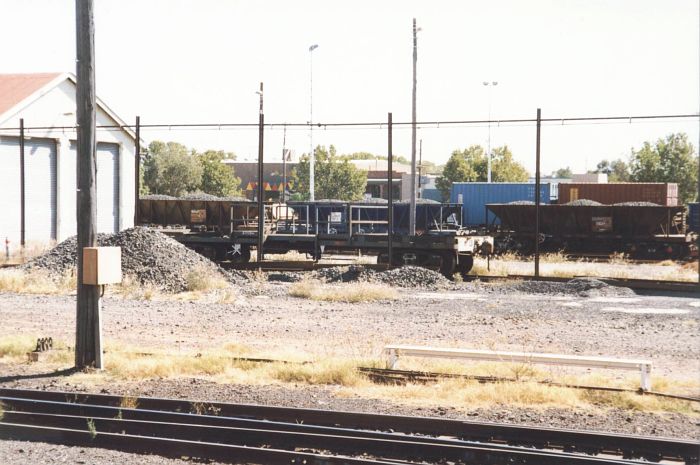 
Dubbo's yard shunters wagon, sitting beyond the dirt track that remains to
mark the carriage siding.  The new coach station is directly above the
shunter's wagon.
