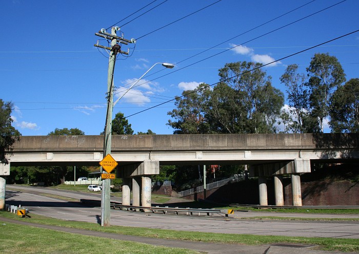 The road overpass over Kissing Point Road, Dundas station is to the right.