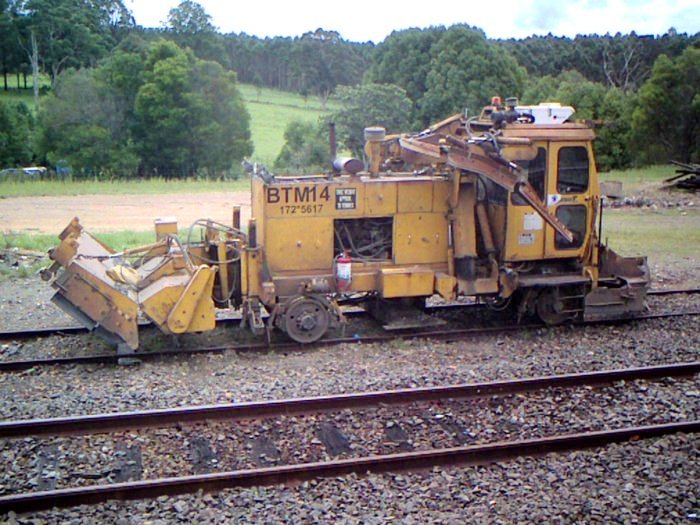 A ballast regulator stored in the siding for track maintenance.