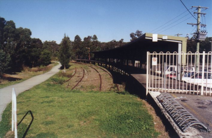 
The shelter along the branch-line platform, with the remains of the
line.  The track on the left was a storage siding, connected to the
branch beyond the curve.
