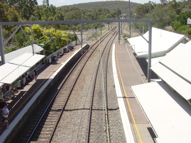 The view looking north. Just barely visible in the distance is a crossover between the Up and Down lines, plus the points on the Down Line connecting the southern leg of the Newstan Colliery branch triangle, to the left of this image.