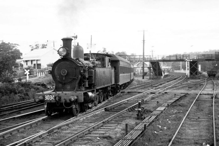 Steam locomotive 3034 is moving from the Toronto branch onto the Down Main, in this view looking south. 