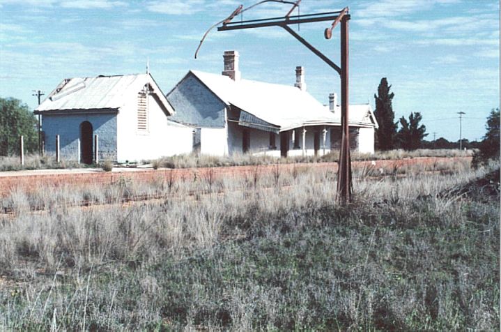 
The station building with brick faced platform.  The structure in the foreground
appears to be a device for checking the loading gauge of trains.
